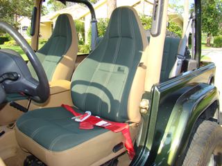 1998 Jeep Wrangler - Interior view of a Jeep, showing the seats, steering wheel, and dashboard.