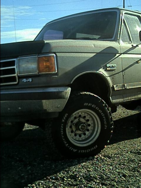 1989 Ford Bronco - This truck has a '4x4' badge on the fender and a grille consistent with the 1987-1991 Ford F-Series.