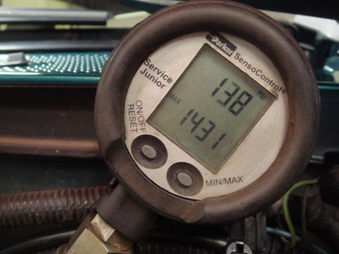 1996 Ford Bronco - Digital pressure gauge displays readings of 138 and 143.1 PSI.