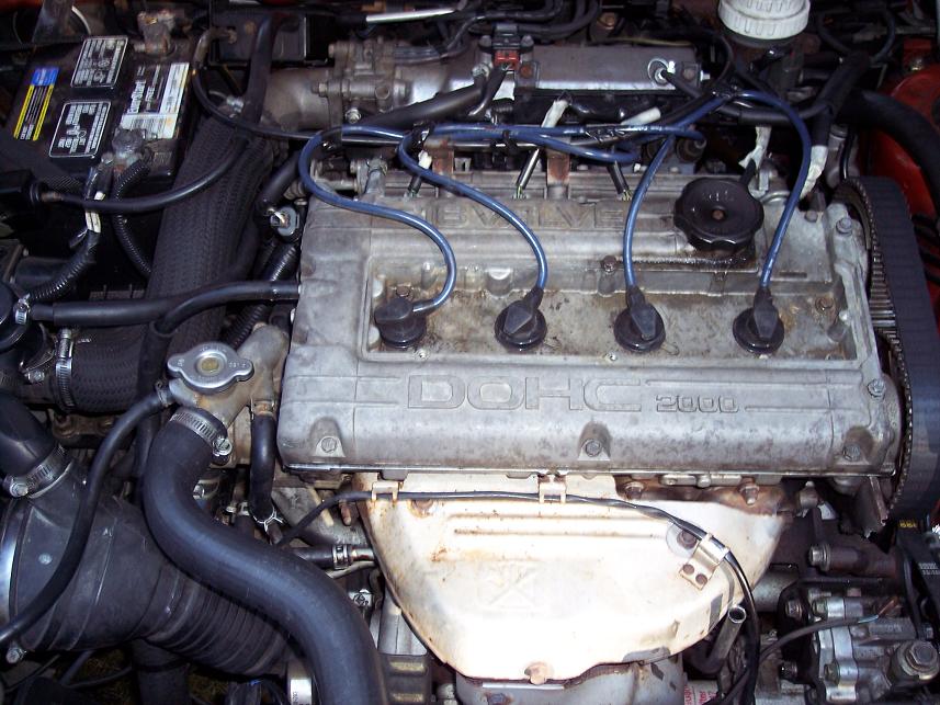 DOHC 2000 16-valve four-cylinder engine with blue plug wires and white intake manifold
