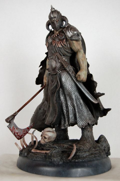 1991 Ford Bronco - A detailed statue depicts a fierce warrior, complete with armor, a bloody axe, and a macabre base of bones and a skull.