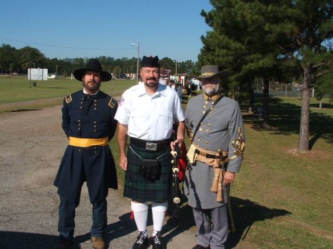 1966 Ford Ranchero - Three men pose for a photo in historical costumes, including a Union soldier, a bagpiper, and a Confederate soldier.
