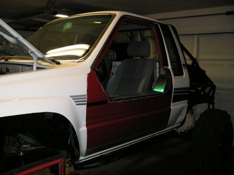 1986 Toyota Hilux - This 1986 Toyota Hilux pickup truck is undergoing modifications in a garage.