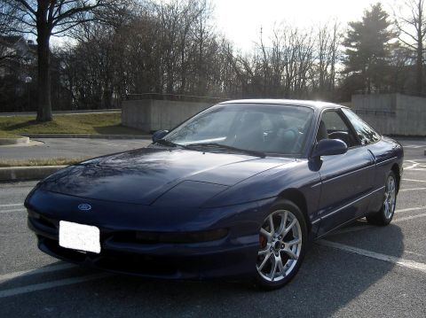 1993 Ford Probe - The front quarter view of a blue 1993 Ford Probe shows its distinctive body style and alloy wheels.