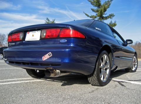 1993 Ford Probe - Rear view of a blue 1993 Ford Probe GT, showing its distinctive taillights and dual exhaust.