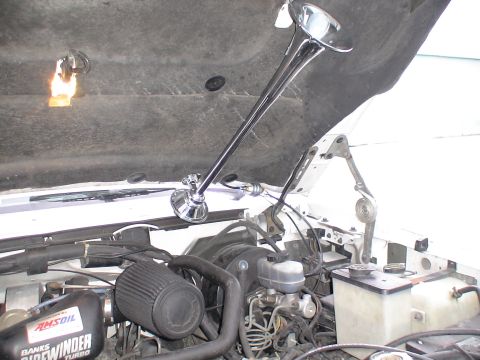 1993 Ford C-350 (Centurion Conversions) - A chrome air horn is installed in the engine bay, alongside a Banks Sidewinder Turbo air filter.