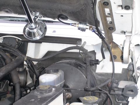 1993 Ford C-350 (Centurion Conversions) - Engine bay view of an aftermarket air horn and compressor installation.