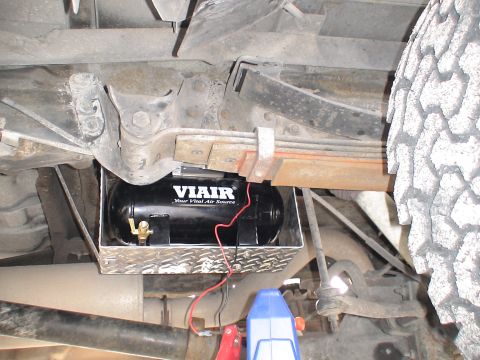 1993 Ford C-350 (Centurion Conversions) - This photo shows an aftermarket VIAIR air compressor tank installed on the underside of a vehicle.