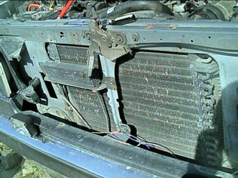1989 Ford Bronco - Front view of the engine bay of a 1989 Ford Bronco, highlighting the radiator and condenser assembly.