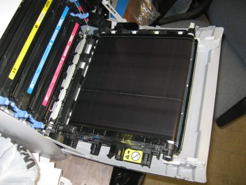 2001 Ford F-150 - The interior of a printer shows multiple toner cartridges, including yellow, cyan, and magenta.