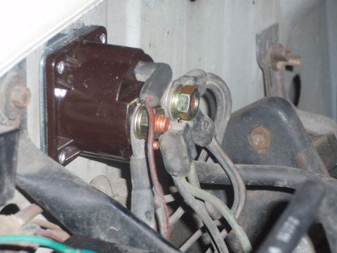 1987 Ford Bronco - Close-up view of a vehicle's starter solenoid and associated wiring.