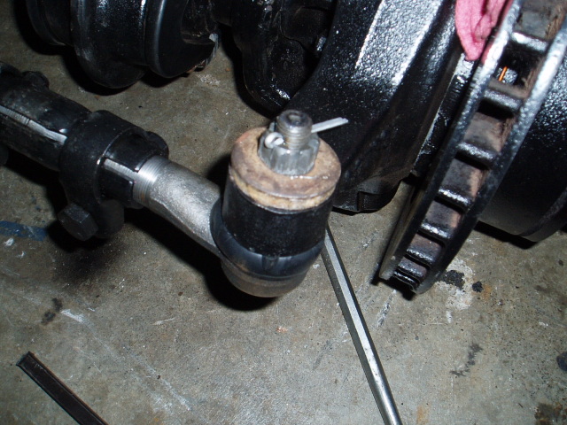 Added .25" thick warsher on top so that the shank of the tie-rod would seat properly.