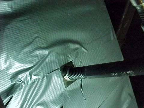 1913 Ford Model T - Installing the 7/16 X 14 NC Heli Coil insert with special installation tool. A punch is used to break off the tab after the insert is seate…
