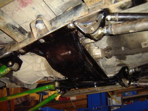 1992 Ford Bronco - Underside view of a vehicle's drivetrain and suspension components, showing modifications.