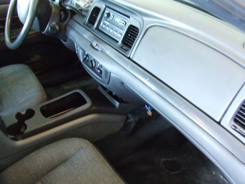 2003 Ford Crown Victoria - Interior view of a 2003 Ford Crown Victoria, highlighting the dashboard and console.