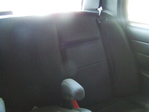 2003 Ford Crown Victoria - Interior view of the rear seat and headrest in a 2003 Ford Crown Victoria.