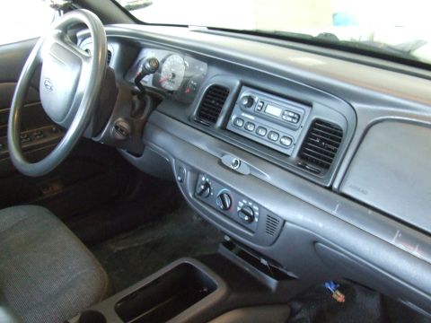 2003 Ford Crown Victoria - Interior view of a 2003 Ford Crown Victoria, highlighting the dashboard and controls.