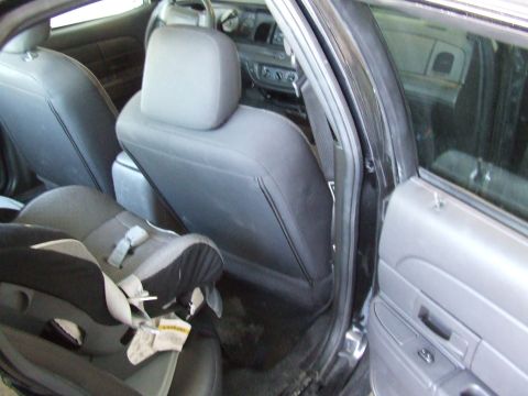 2003 Ford Crown Victoria - Interior view of a 2003 Ford Crown Victoria, including a child safety seat.