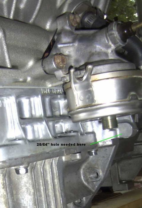 1997 Ford Taurus - A close-up view of an engine component, possibly a fuel pump assembly, with a measurement instruction.