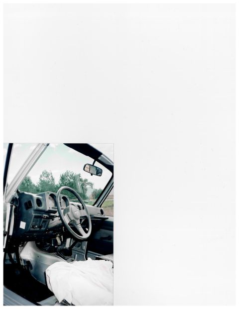 1988 Suzuki Samurai - The interior of a Suzuki Samurai is shown, with a white sheet covering the passenger seat.