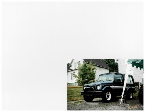 1988 Suzuki Samurai - A dark blue 1988 Suzuki Samurai is parked in a driveway next to a house.