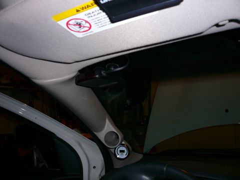 1996 Ford Probe - Aftermarket gauges are installed on the A-pillar, with a warning label visible on the sun visor.