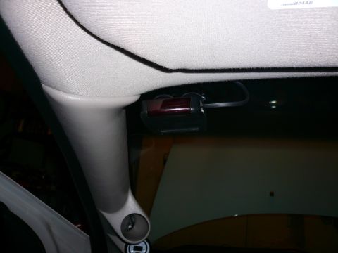 1996 Ford Probe - Interior view of a car's headliner with an attached electronic device.