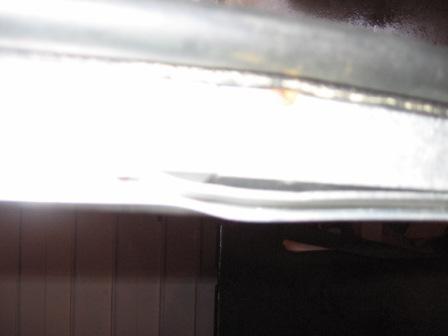 1993 Ford Bronco - Rear fast track rail. View of slight bend