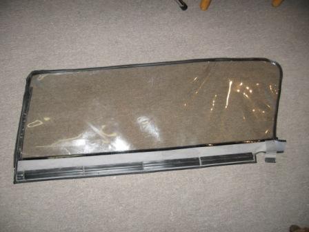 1993 Ford Bronco - Driver's side window, interior shot. Window has slight scuffs, but has excellent visibility.