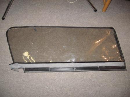1993 Ford Bronco - Passenger side window, interior shot. Window has slight scuffs, but has excellent visibility.