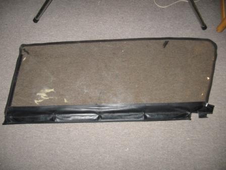 1993 Ford Bronco - Passenger side window, exterior shot. Window has slight scuffs, but has excellent visibility. Black marks are from where the black vinyl co…