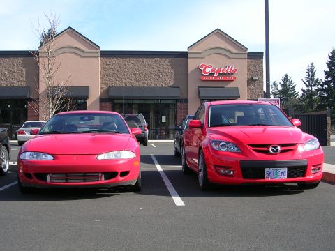 2007 Mazda 3 - A 2007 Mazda 3 and a Mitsubishi Eclipse are parked in front of the Capello Salon and Spa.