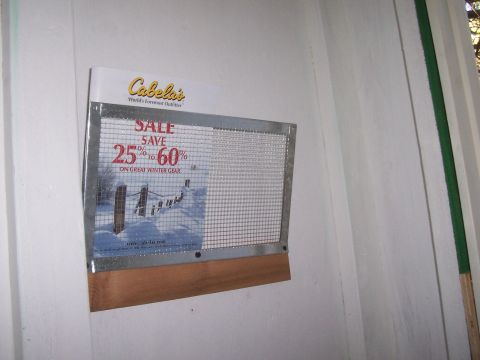 1994 Ford F-150 - A Cabela's advertisement for winter gear is displayed on a wall, offering savings of 25% to 60%.