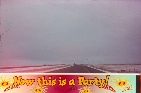 1989 Ford F-250 - A highway stretches into the distance under a cloudy sky, with a decorative banner at the bottom proclaiming 'Now this is a Party!'.