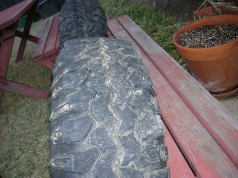1999 Land Rover Discovery II - Close-up of two off-road tires, likely for an SUV or truck, outdoors.