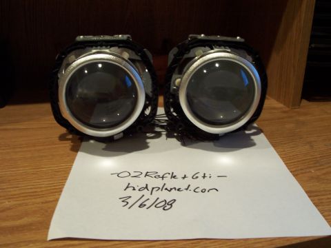 1993 Ford Probe - A pair of projector headlights are shown with a note indicating their origin and date.