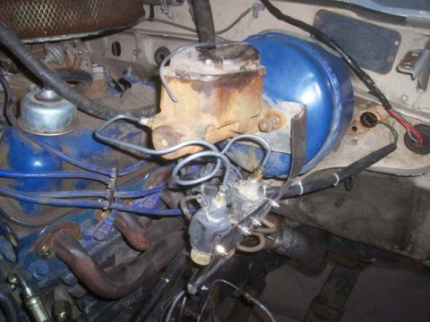 1982 Toyota 4Runner - Close-up of a vehicle's engine bay, focusing on the brake system components.