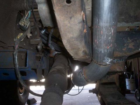 1982 Toyota 4Runner - Underside view of a vehicle's exhaust system and frame components.