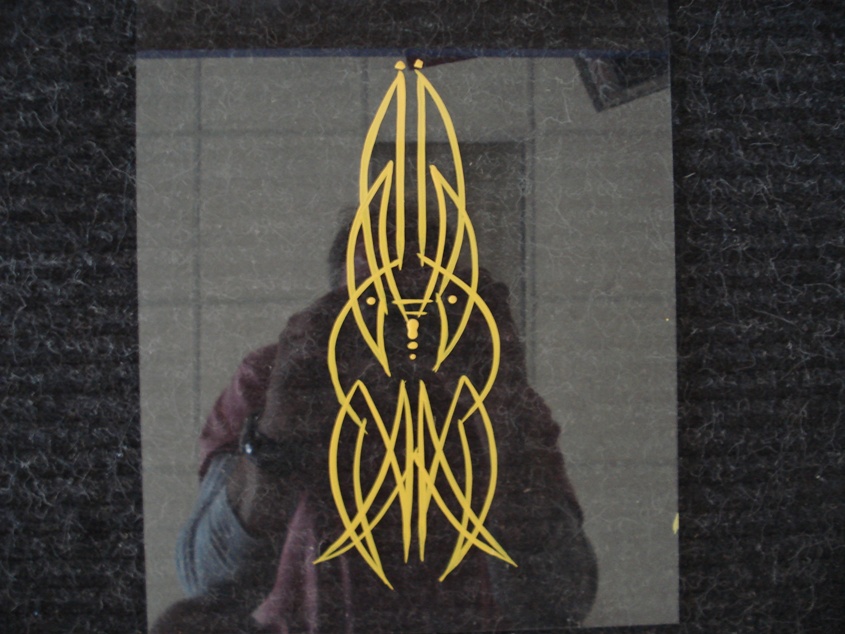 Yellow pinstripe graphic on dark surface