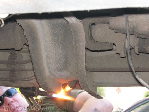 1987 Suzuki Samurai - Cutting the underbody of a vehicle with a torch.