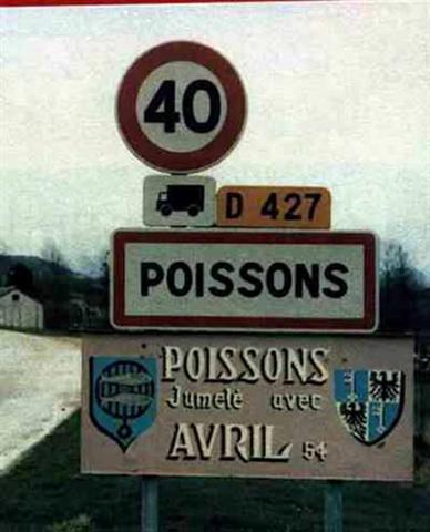 1991 Ford Crown Victoria - Road signs indicate the towns of Poissons and Avril, with a speed limit of 40 and route D 427.