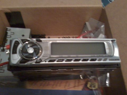 1993 Ford Probe - A car stereo is shown inside a cardboard box.