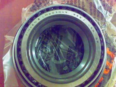 1995 Ford F-150 - A close-up view of a Timken LM603049 bearing, showing its part number and branding.
