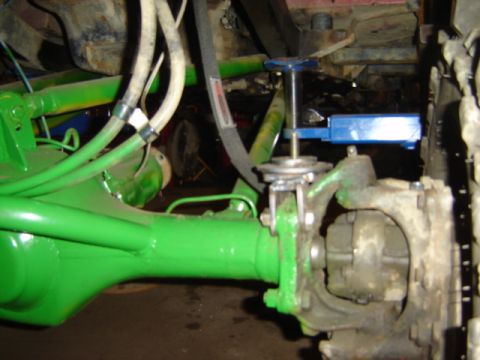 1992 Ford Bronco - The image shows a close-up view of a vehicle's suspension and axle assembly, with some parts painted green.