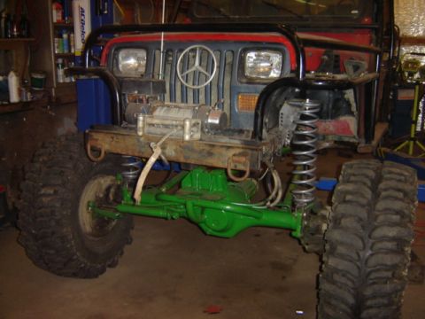 1992 Ford Bronco - This heavily modified vehicle features a Mercedes-Benz emblem on its grille and a winch mounted on the front bumper.