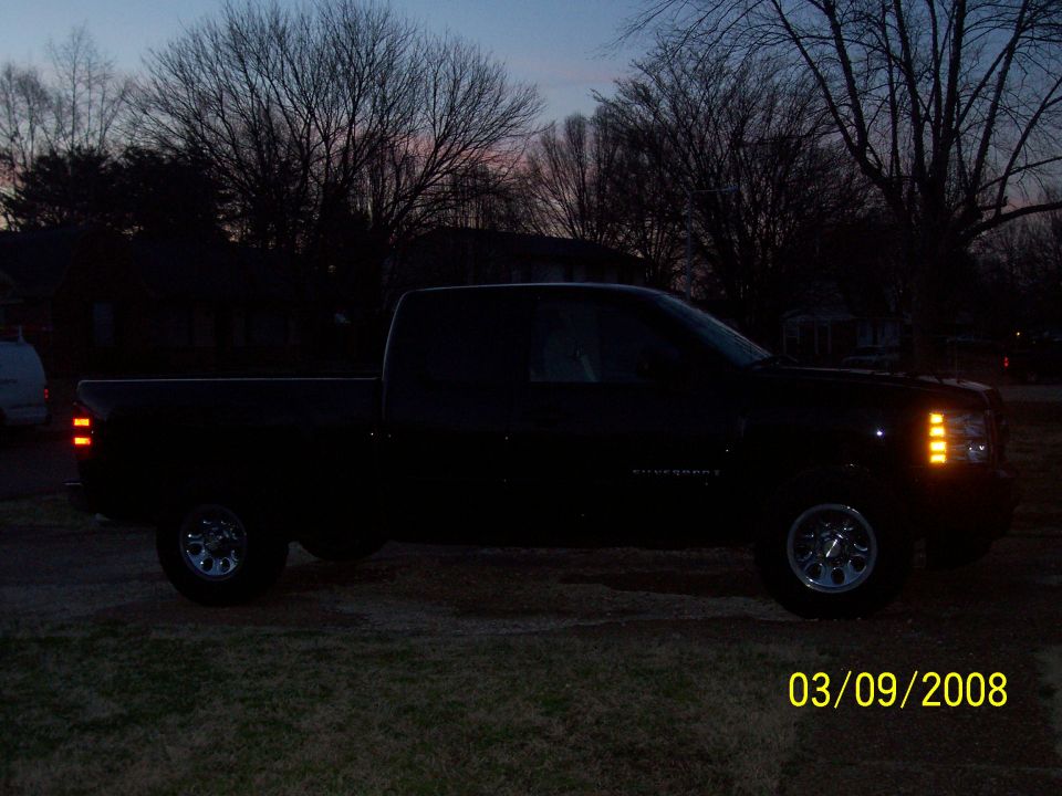Black 2008 Chevrolet Silverado 1500 pickup truck parked outside at dusk