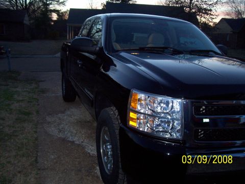 2008 Chevrolet Silverado 1500 - A black pickup truck is shown from the front three-quarter view, with a date stamp indicating March 9, 2008.