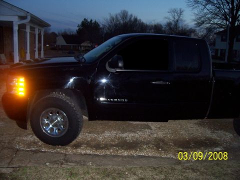 2008 Chevrolet Silverado 1500 - Side view of a black 2008 Chevrolet Silverado 1500 pickup truck.