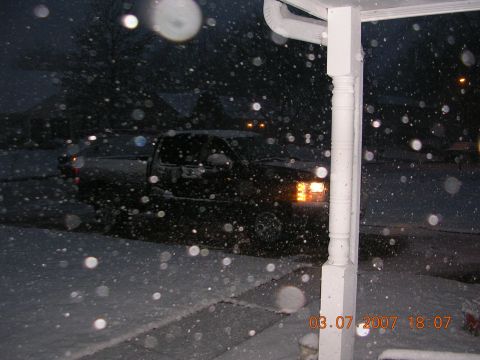 2008 Chevrolet Silverado 1500 - A pickup truck is parked in the snow at night, with a date stamp indicating it was taken in 2007.