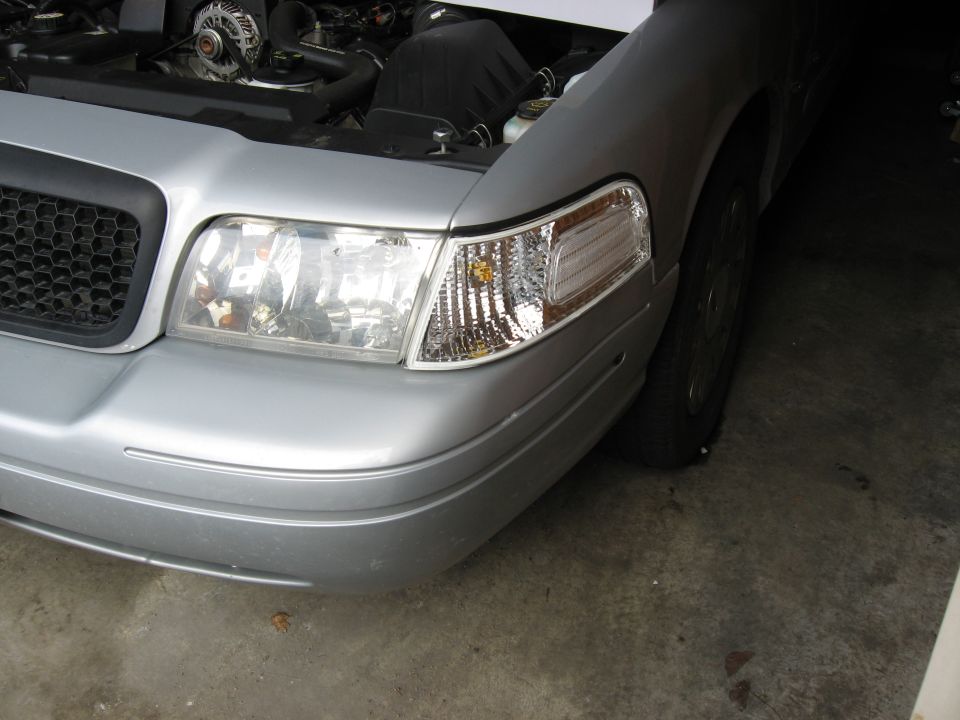 2004 Ford Crown Victoria front end, hood open showing engine components